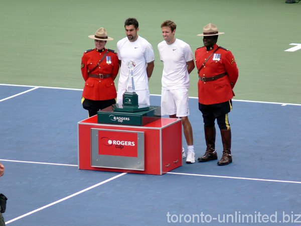 Nestor and Zimjonic with guard of honor RCMP officers.l