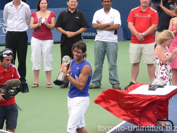 Rafael Nadal carrying his Trophy.