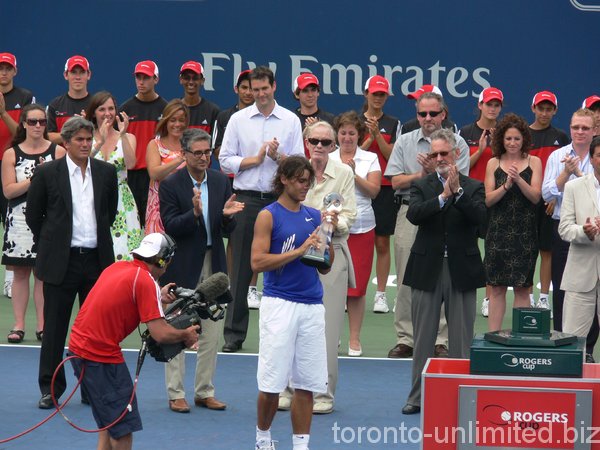 Rafael Nadal Champion with Ted Roger behind.