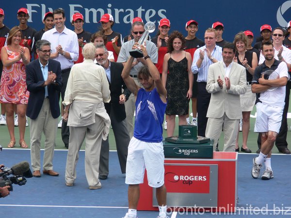 Rafael Nadal lifting Championship Trophy. 