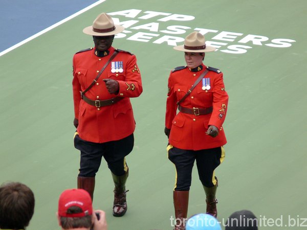 RCMP officers marching on the court.