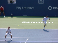 Zimjonic serving and Nestor at the net.