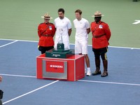 Nestor and Zimjonic with guard of honor RCMP officers.l
