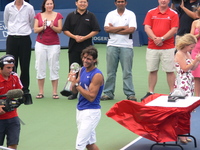 Rafael Nadal carrying his Trophy.