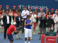 Rafael Nadal Champion with Ted Roger behind.