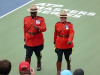 RCMP officers marching on the court.