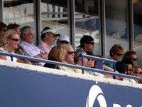 Ted Rogers (with glasses) sitting in Tennis Canada Lounge.