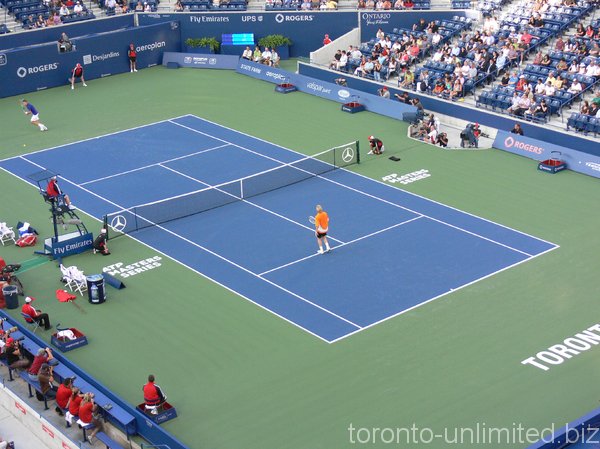 Boris Becker and Daniel Nestor playing an exhibition match.