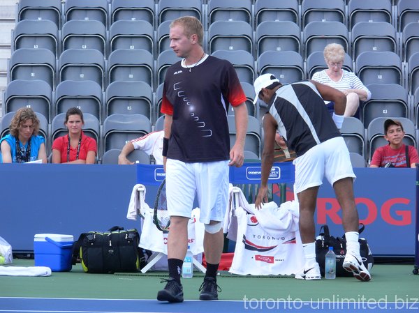 Lukas Dlouhy and Leander Paes before doubles match. 