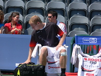 Lukas Dlouhy getting ready for doubles match.